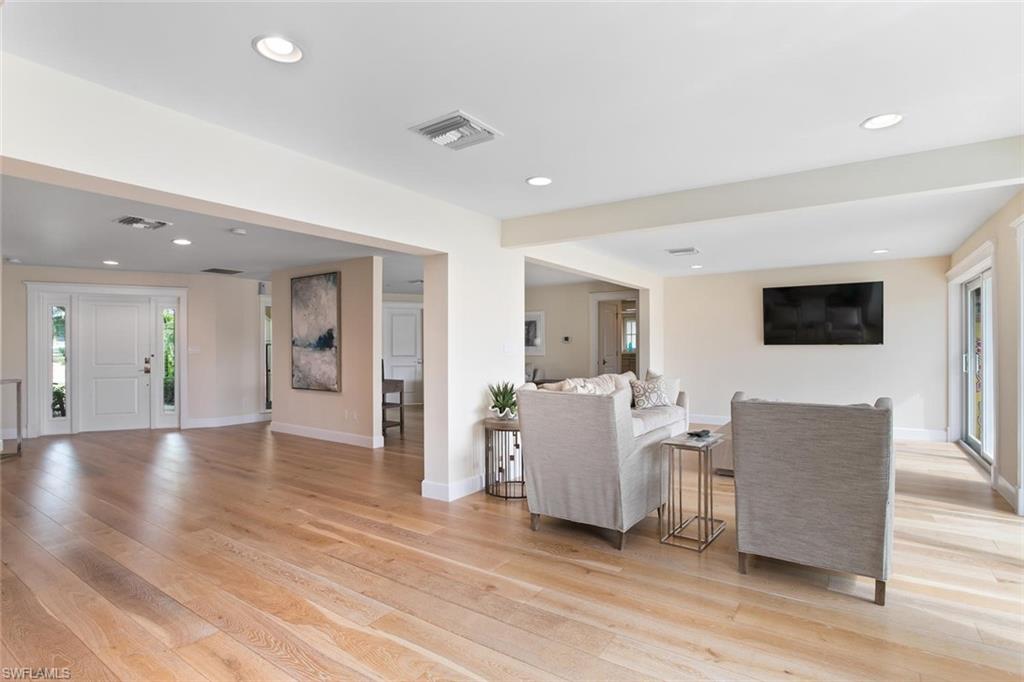 2155 Tarpon Road Naples, FL 34102 - Photo 18 of 24 a living room with furniture and a flat screen tv