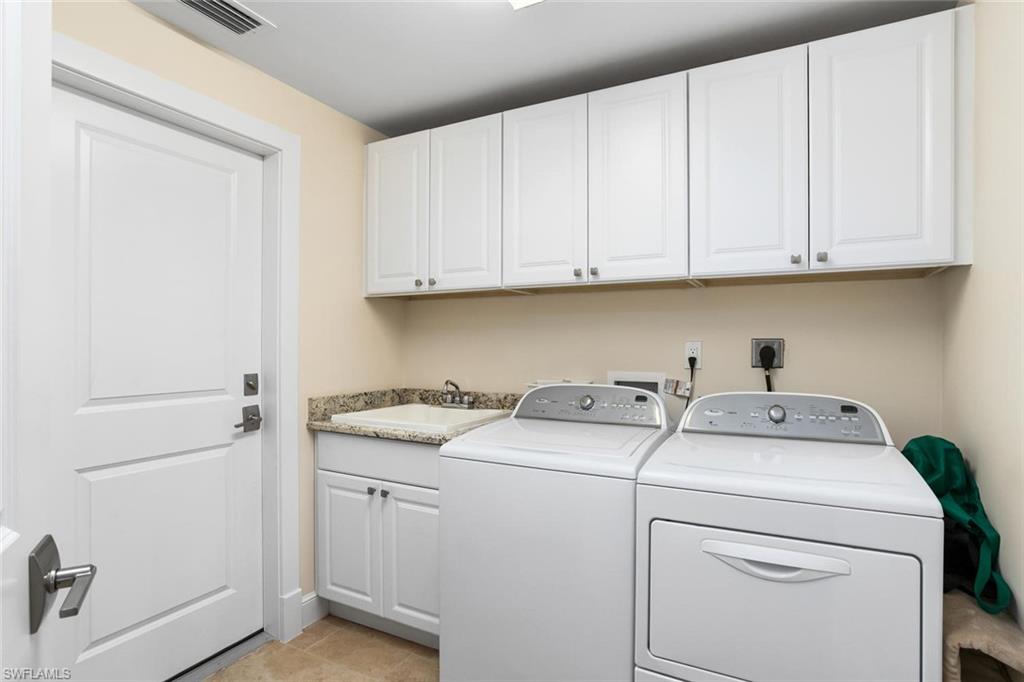 2155 Tarpon Road Naples, FL 34102 - Photo 19 of 24 a utility room with dryer and washer