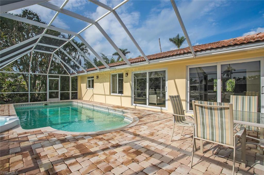 2155 Tarpon Road Naples, FL 34102 - Photo 24 of 24 a view of a backyard with a swimming pool