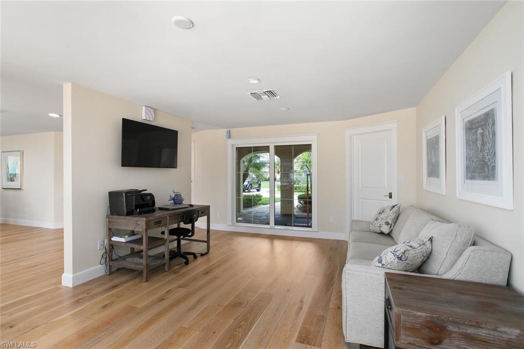 2155 Tarpon Road Naples, FL 34102 - Photo 9 of 24 a living room with furniture and a flat screen tv