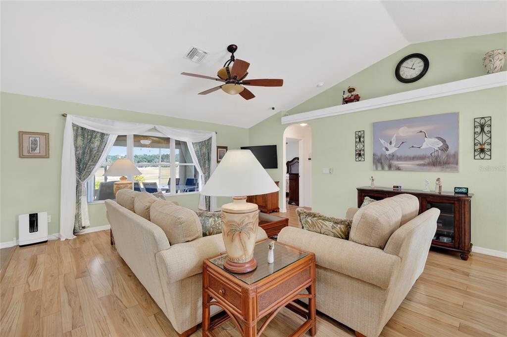 12384 Southeast 176th Loop Summerfield, FL 34491 - Photo 11 of 30 a living room with furniture and a wooden floor