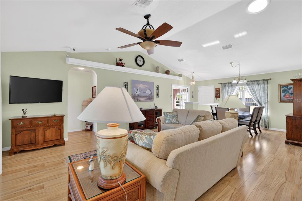 12384 Southeast 176th Loop Summerfield, FL 34491 - Photo 12 of 30 a living room with furniture and a flat screen tv