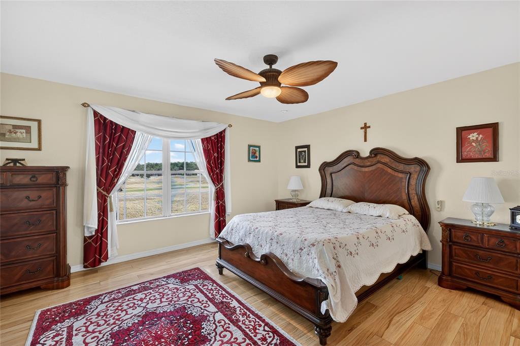 12384 Southeast 176th Loop Summerfield, FL 34491 - Photo 20 of 30 a bedroom with a bed and a window