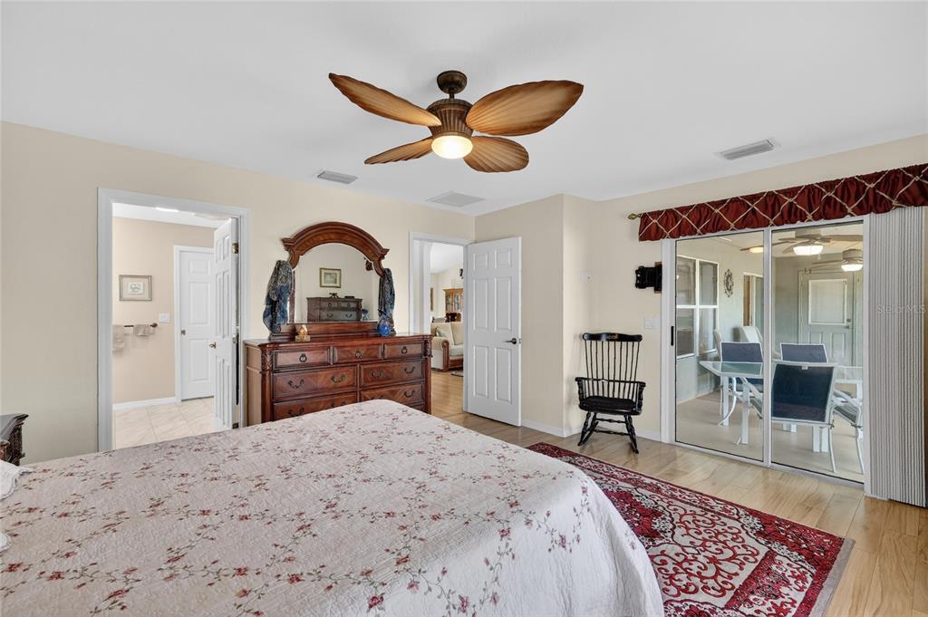 12384 Southeast 176th Loop Summerfield, FL 34491 - Photo 21 of 30 a bedroom with a bed and a dresser next to a window