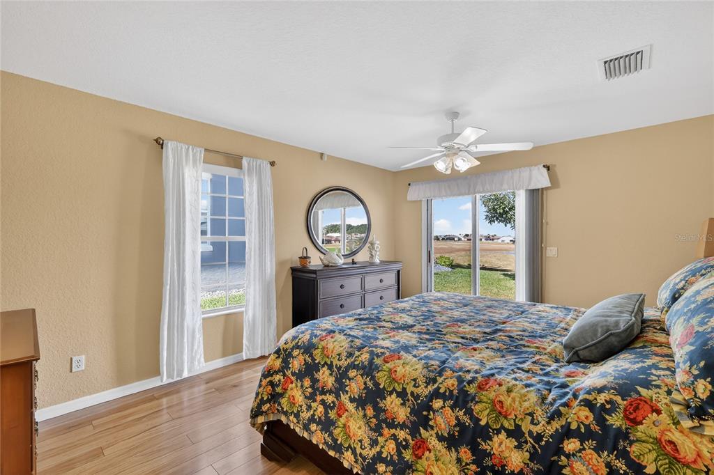 12384 Southeast 176th Loop Summerfield, FL 34491 - Photo 25 of 30 a bed sitting in a bedroom next to a window