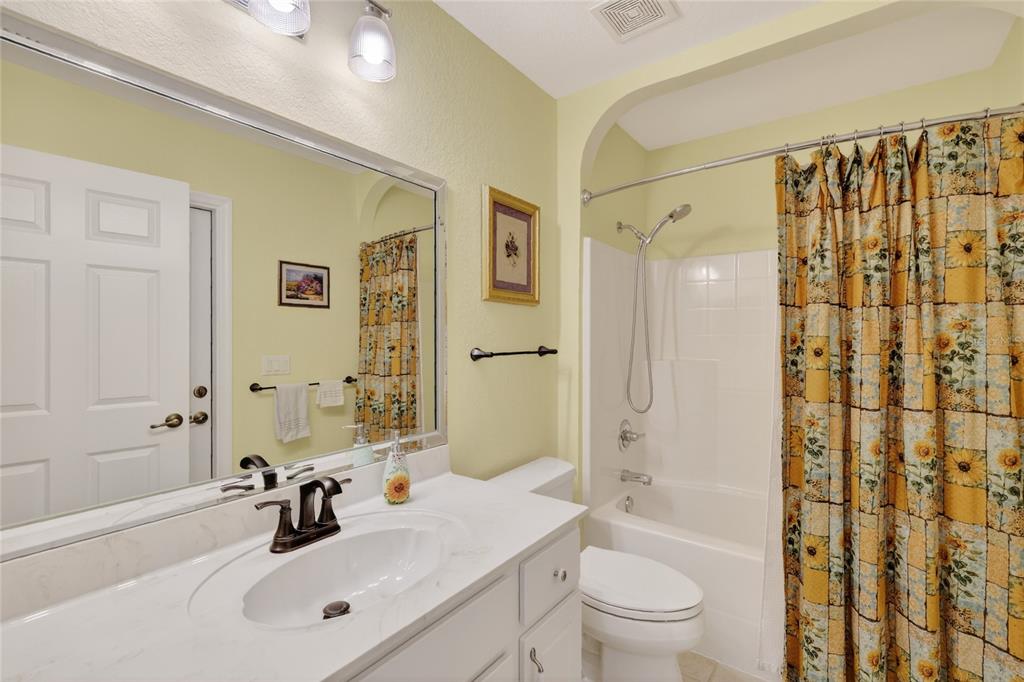 12384 Southeast 176th Loop Summerfield, FL 34491 - Photo 26 of 30 a bathroom with a sink a toilet and shower