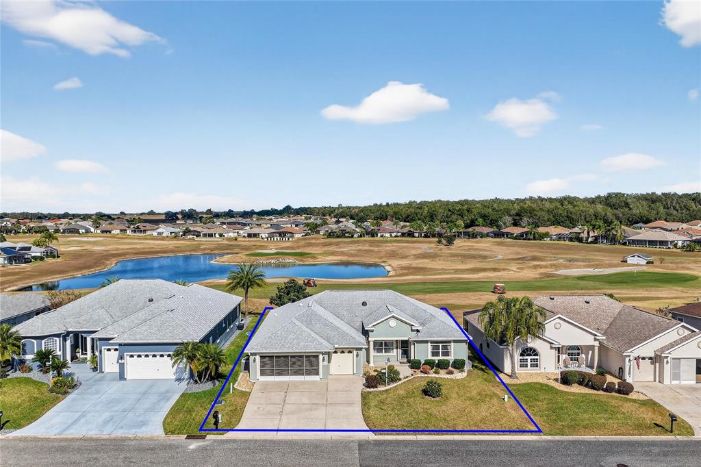 12384 Southeast 176th Loop Summerfield, FL 34491 - Photo 3 of 30 a view of a house with pool and chairs