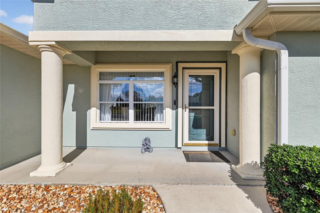 12384 Southeast 176th Loop Summerfield, FL 34491 - Photo 4 of 30 a front view of a house with a yard