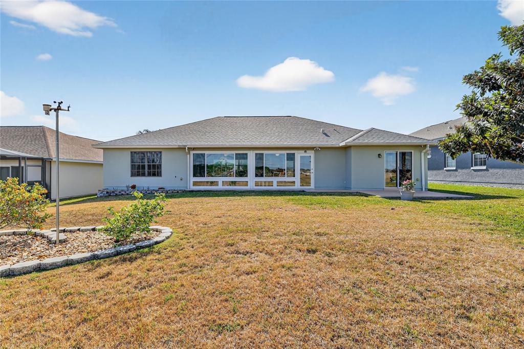 12384 Southeast 176th Loop Summerfield, FL 34491 - Photo 5 of 30 a house with swimming pool in front of it