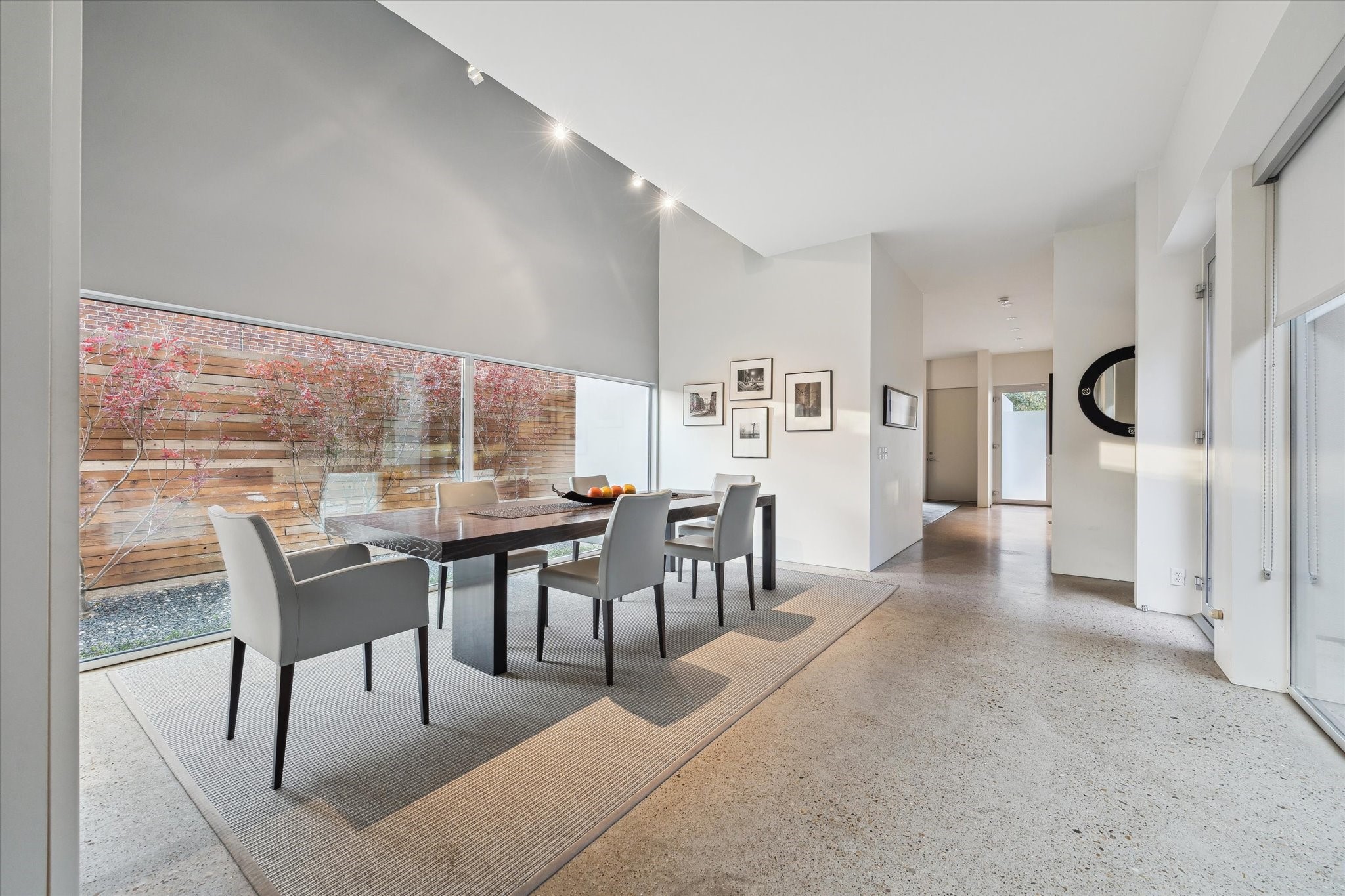 2307 Wroxton Road Houston, TX 77005 - Photo 11 of 35 a dining room with furniture and a floor to ceiling window