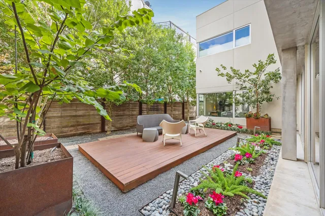a view of a chairs and table in the patio
