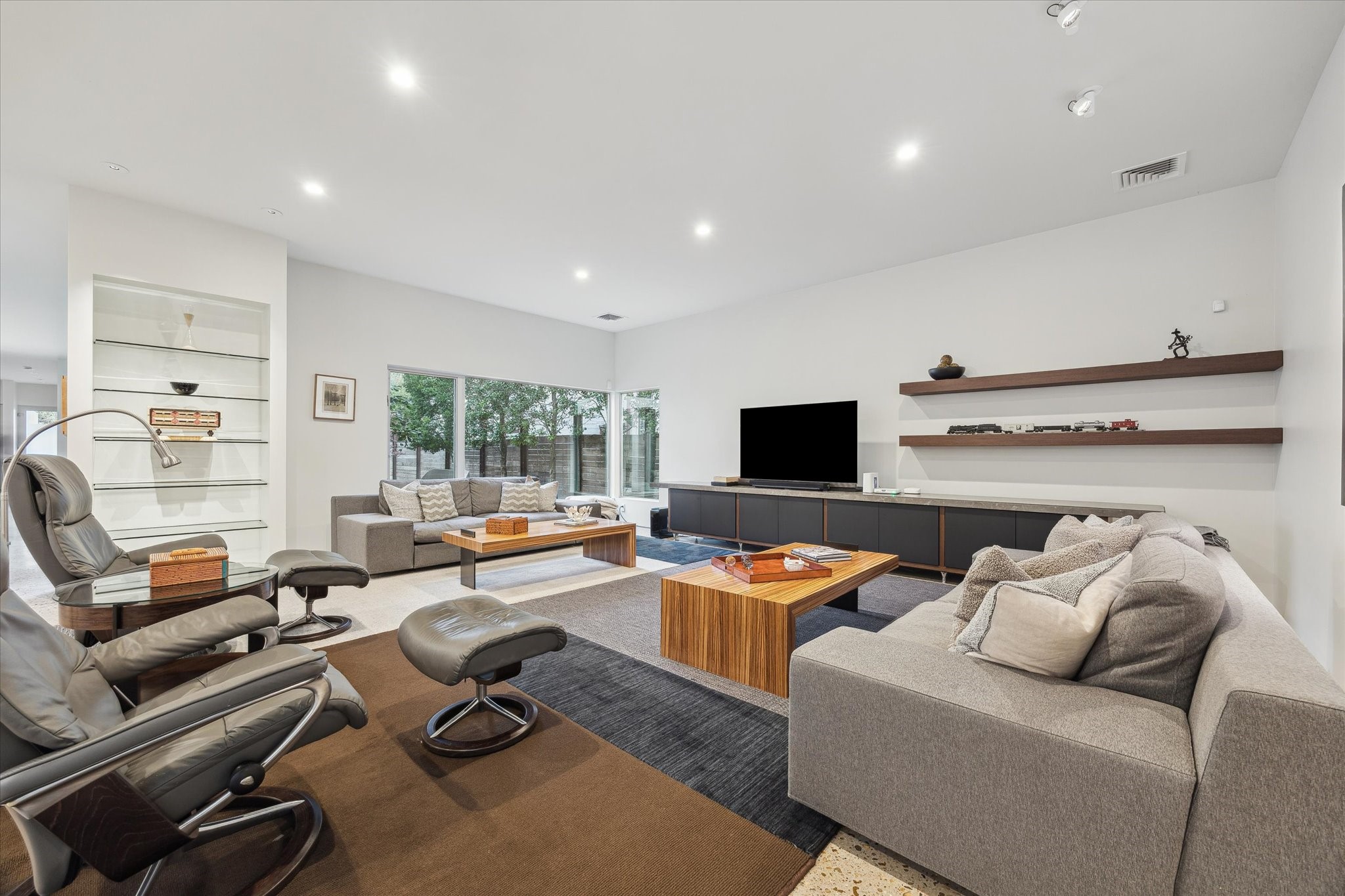2307 Wroxton Road Houston, TX 77005 - Photo 16 of 35 a living room with furniture and a flat screen tv