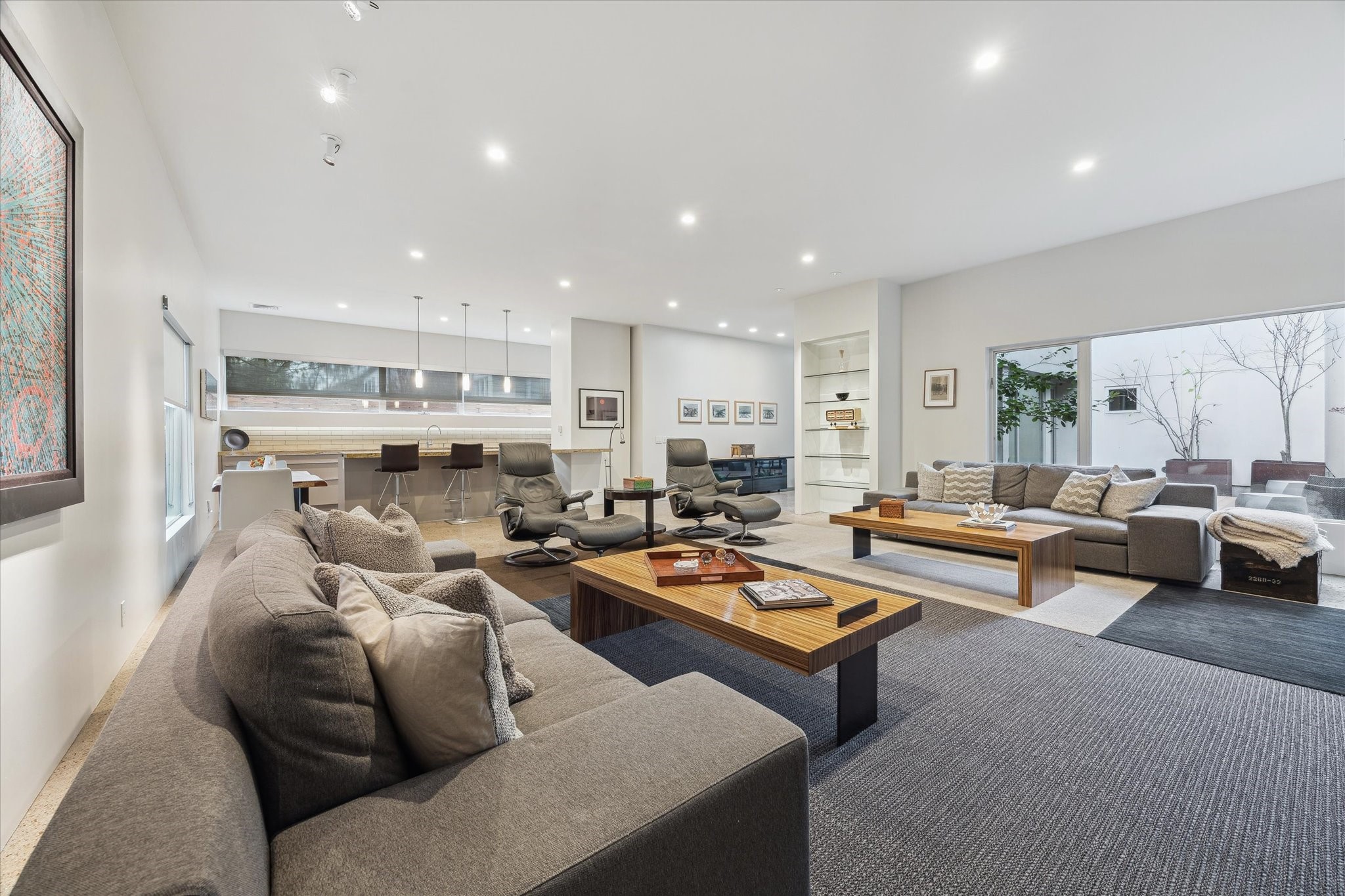 2307 Wroxton Road Houston, TX 77005 - Photo 17 of 35 a living room with furniture kitchen view and a large window