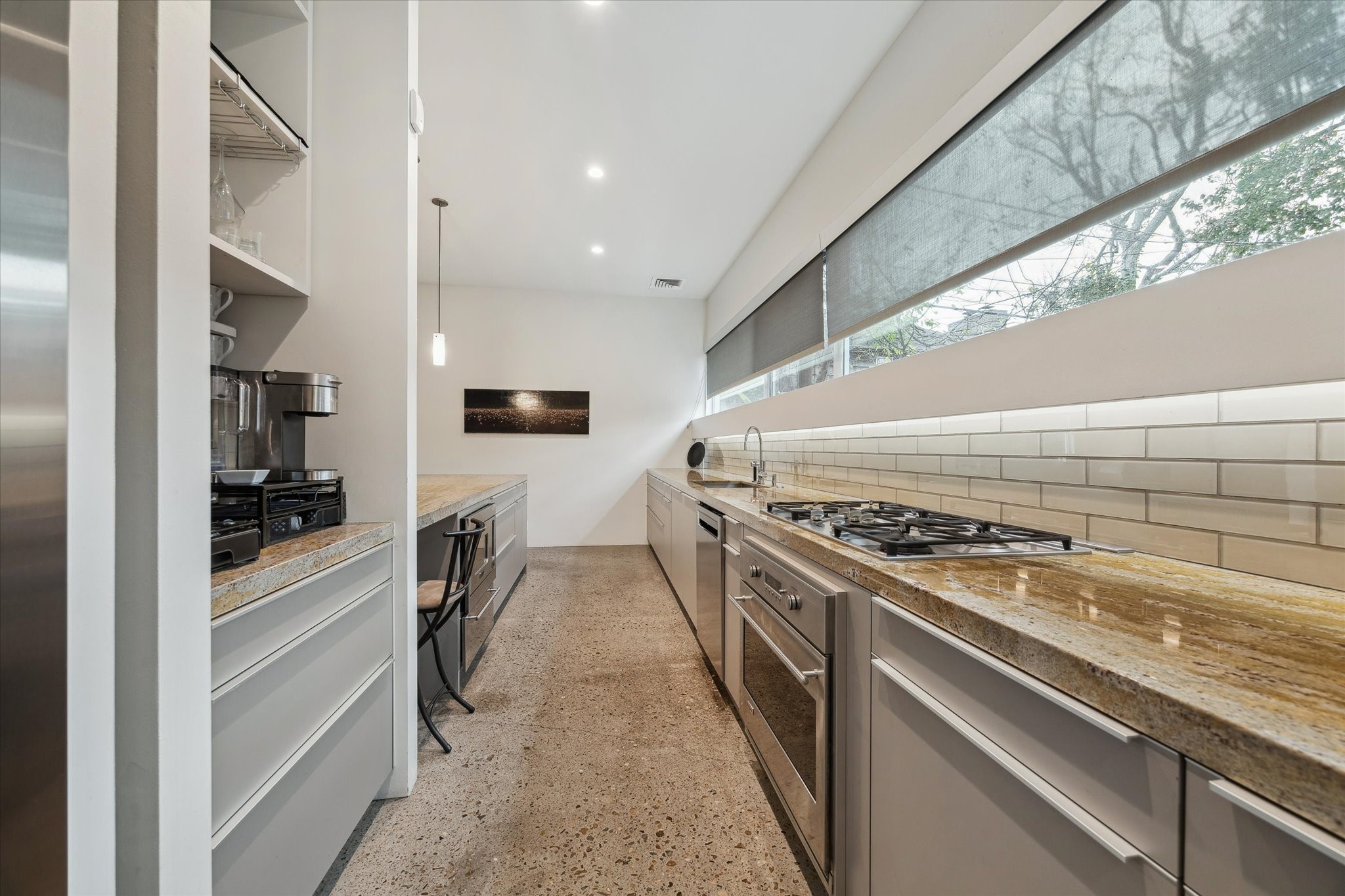 2307 Wroxton Road Houston, TX 77005 - Photo 21 of 35 a kitchen with granite countertop a stove and a refrigerator
