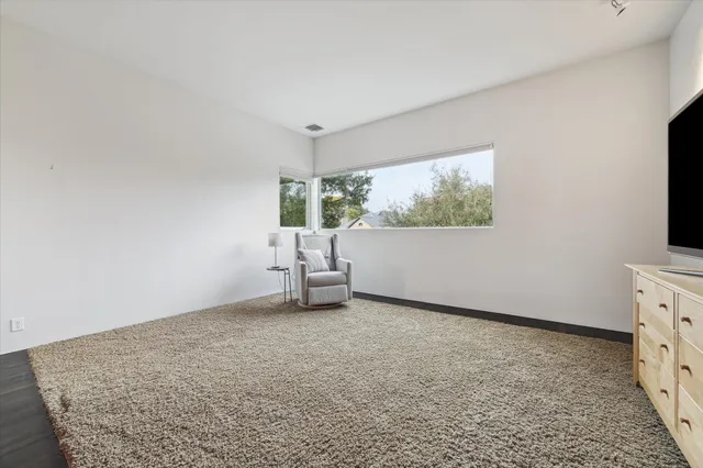 a bathroom with a granite countertop sink a toilet and bathtub