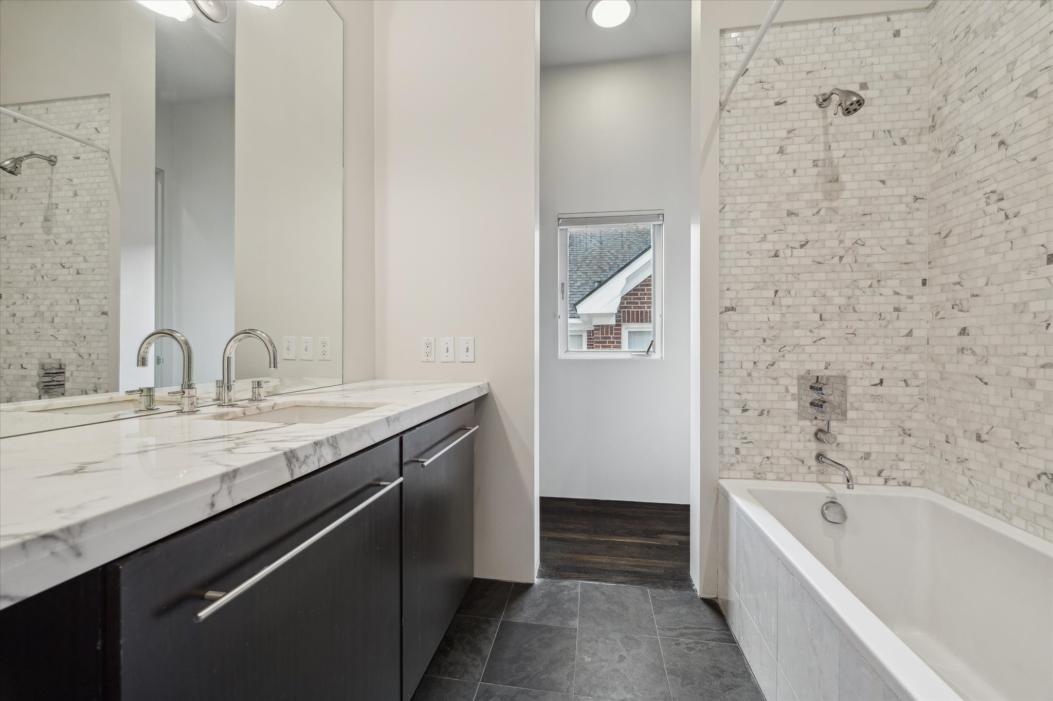 2307 Wroxton Road Houston, TX 77005 - Photo 26 of 35 a bathroom with a granite countertop sink a toilet and bathtub