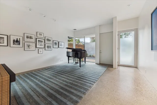 a view of a livingroom with furniture and wooden floor