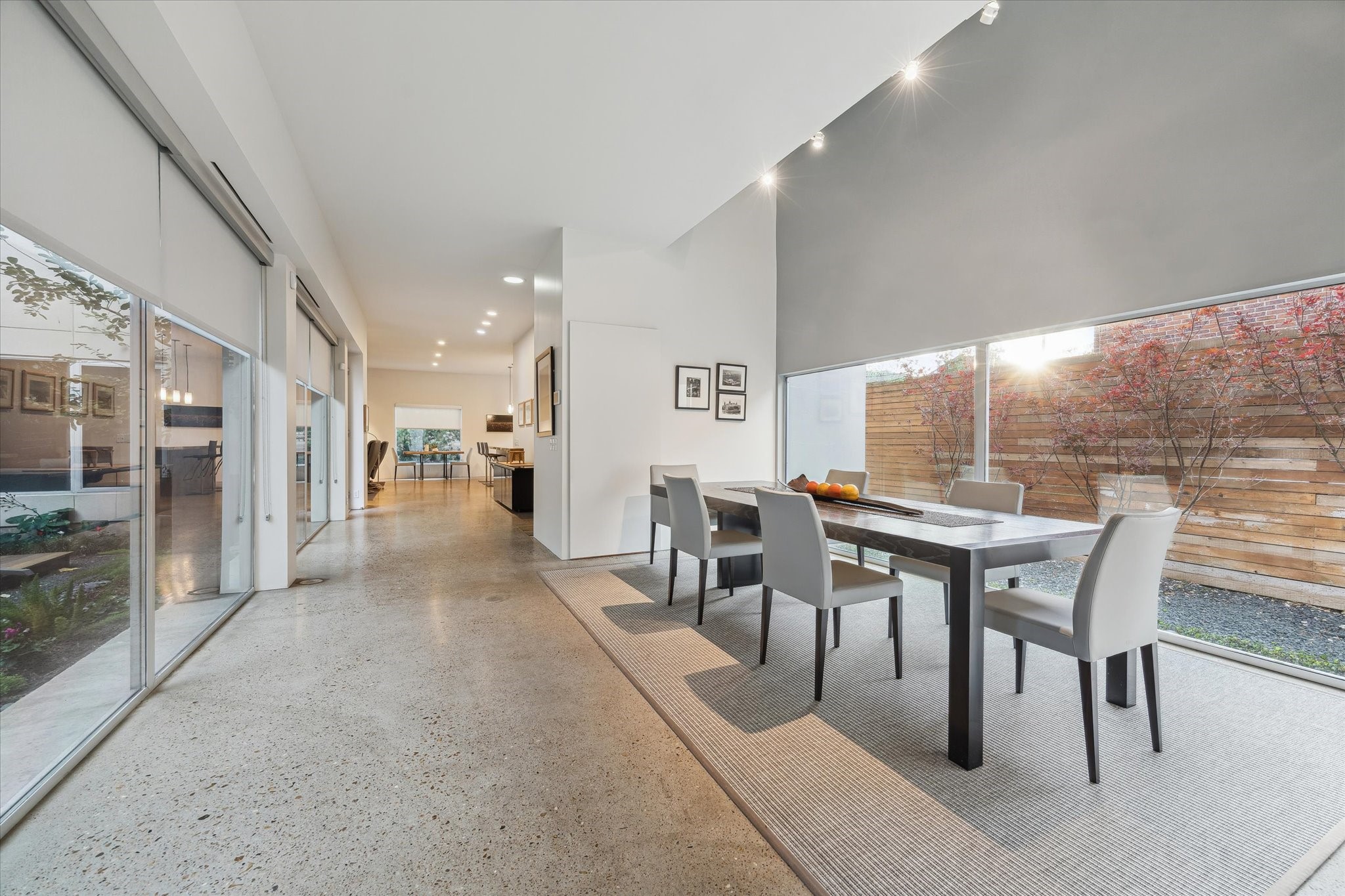 2307 Wroxton Road Houston, TX 77005 - Photo 9 of 35 a dining room with furniture and a floor to ceiling window