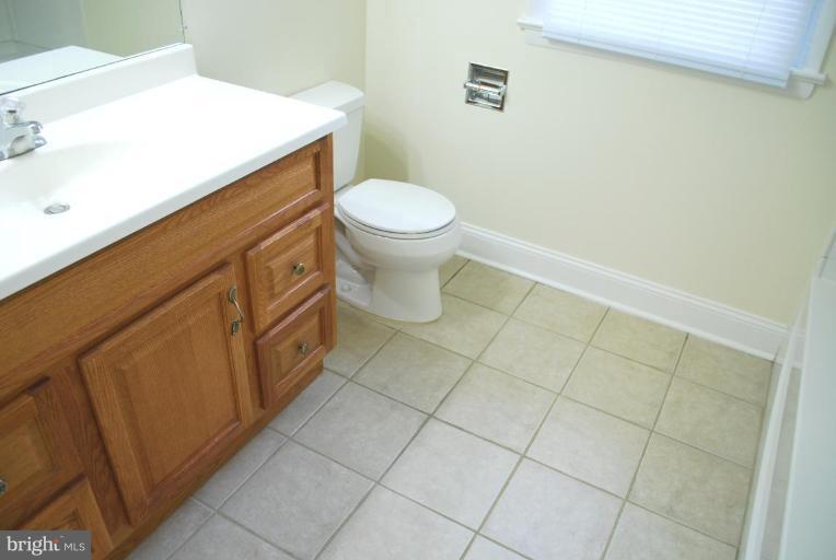 3517 Olympic Street Silver Spring, MD 20906 - Photo 15 of 30 a bathroom with a toilet and a sink