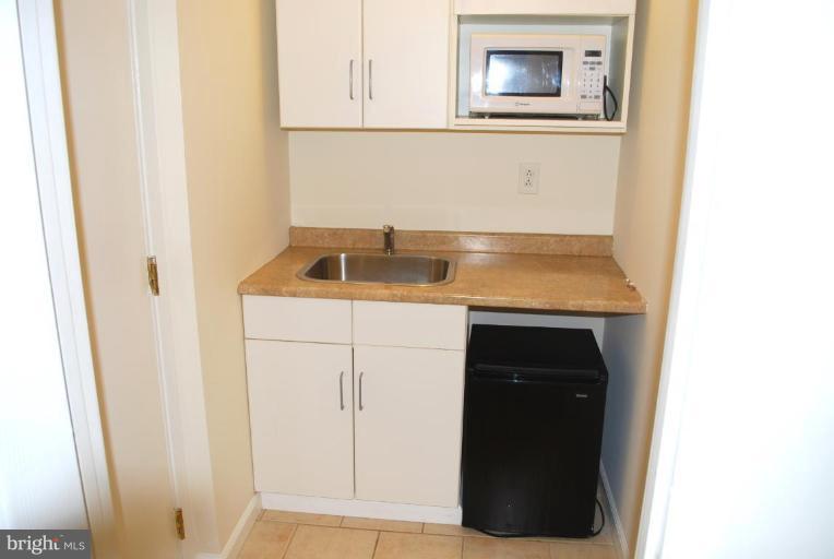 3517 Olympic Street Silver Spring, MD 20906 - Photo 23 of 30 a bathroom with a sink and a mirror