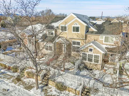 a kitchen with stainless steel appliances granite countertop a sink a stove a refrigerator a microwave and cabinets