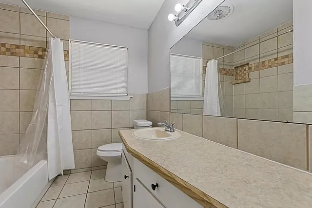 a view of a dining room with furniture and window
