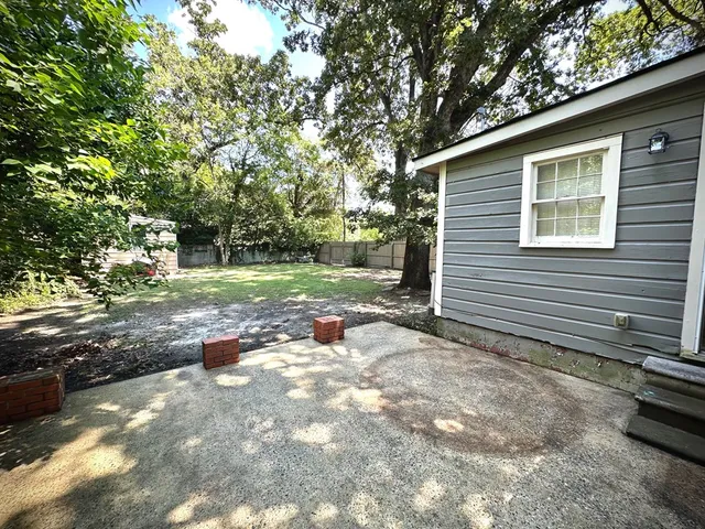 a view of backyard with green space