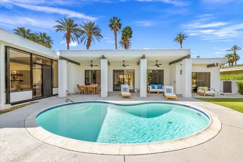 a view of a swimming pool with a patio