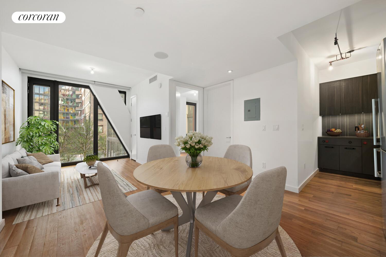 a view of a dining room with furniture and wooden floor