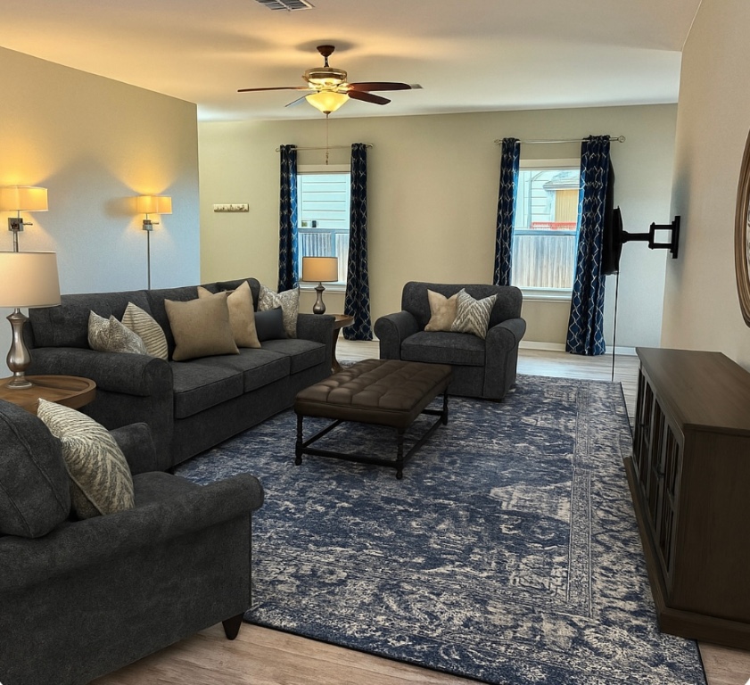 305 Rusk Bluff Avenue Leander, TX 78641 - Photo 11 of 34 a living room with furniture and a chandelier