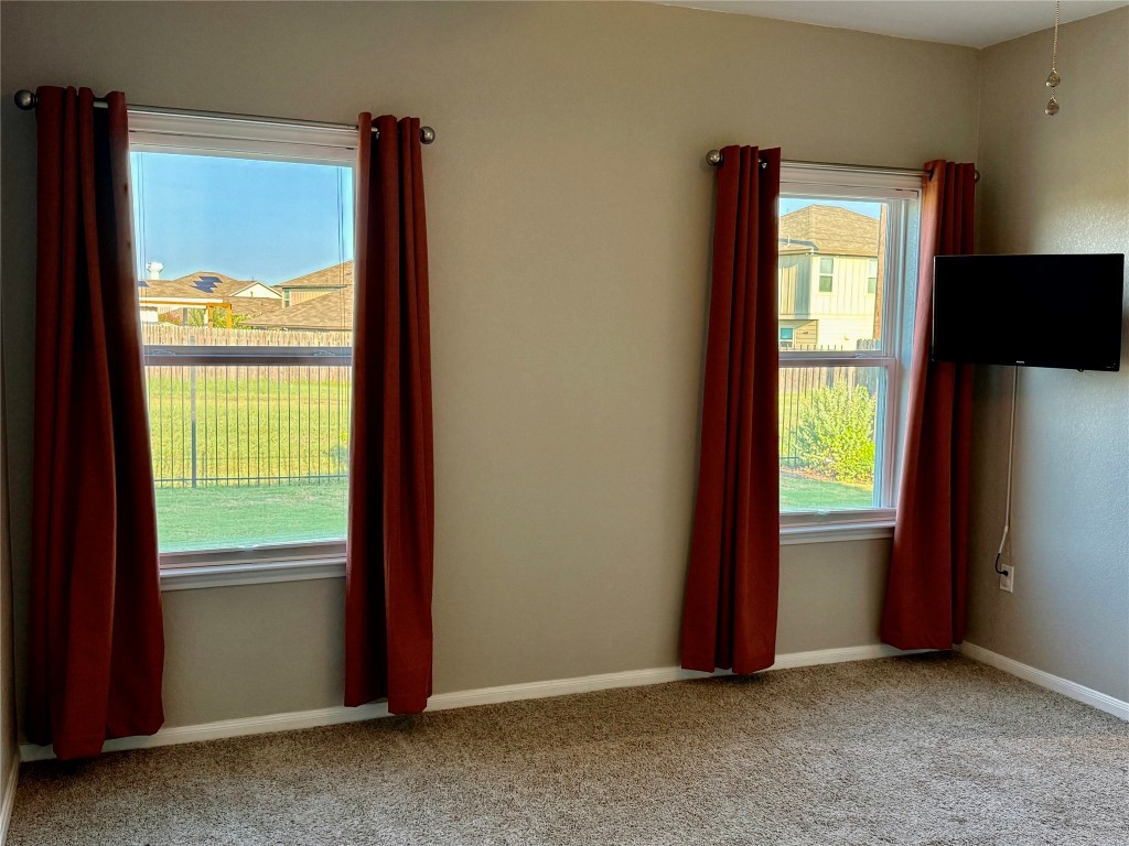 305 Rusk Bluff Avenue Leander, TX 78641 - Photo 20 of 34 a view of an empty room with a window