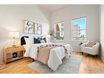 a bedroom with bed and a couch