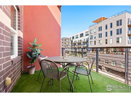 a view of a chairs and table in patio
