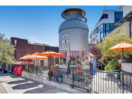 a view of a cafe with sitting area
