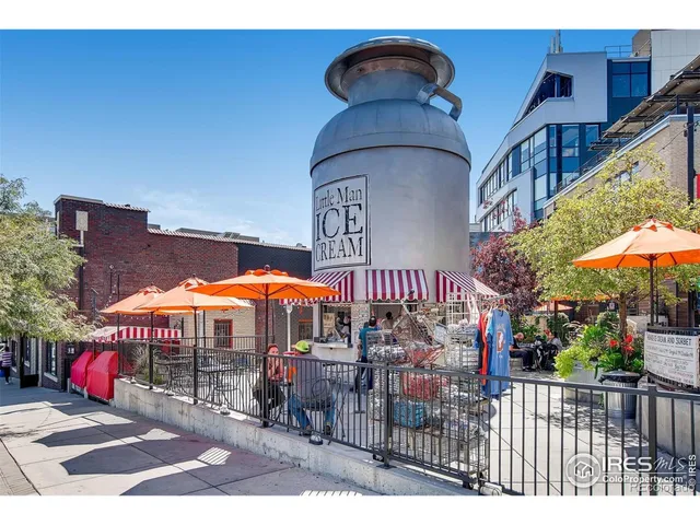 a view of a cafe with sitting area