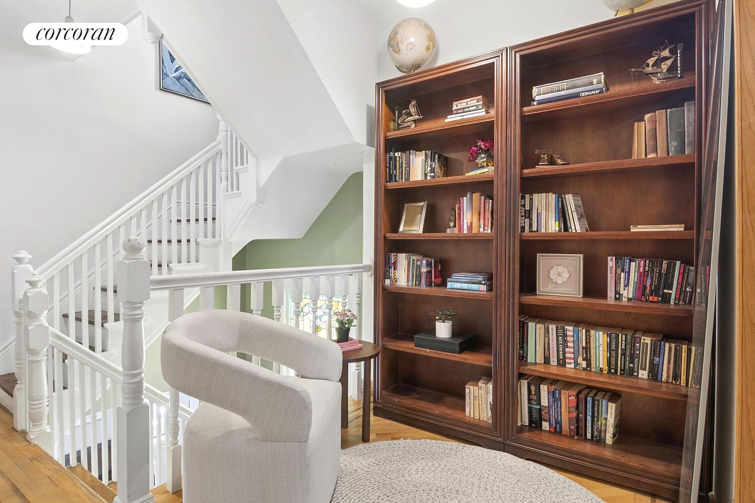 739 Argyle Road Brooklyn, NY 11230 - Photo 11 of 27 a view of staircase with white walls and a book shelf