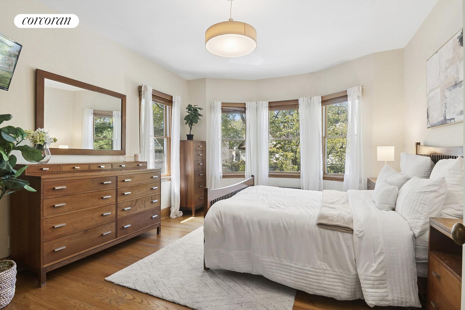 739 Argyle Road Brooklyn, NY 11230 - Photo 12 of 27 a bedroom with a bed and large windows
