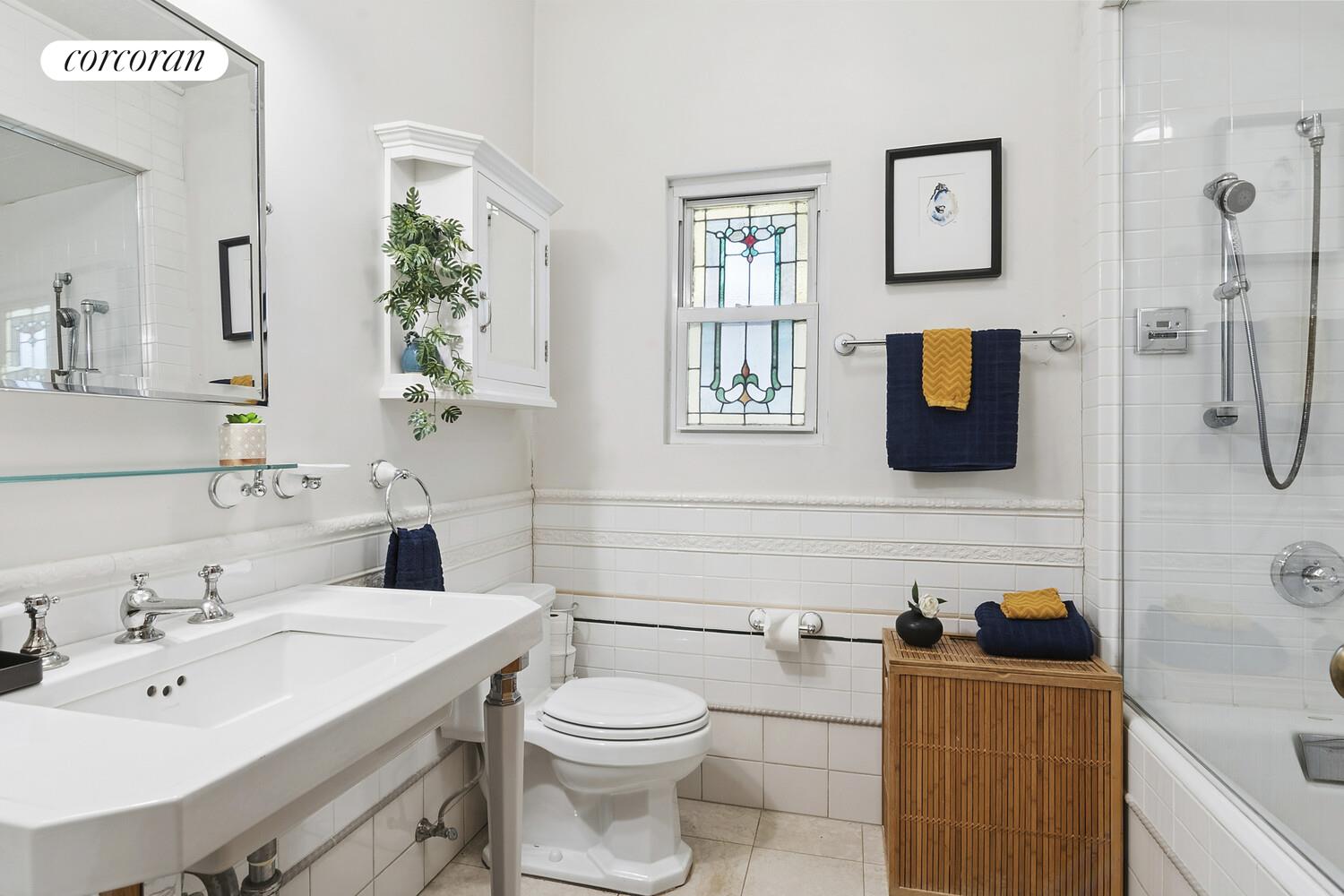 739 Argyle Road Brooklyn, NY 11230 - Photo 13 of 27 a bathroom with a sink a toilet and mirror