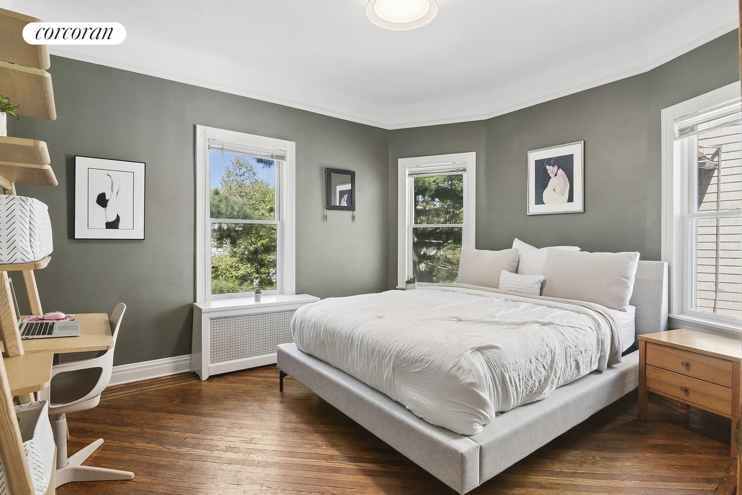 739 Argyle Road Brooklyn, NY 11230 - Photo 14 of 27 a bedroom with a bed wooden floor and a window