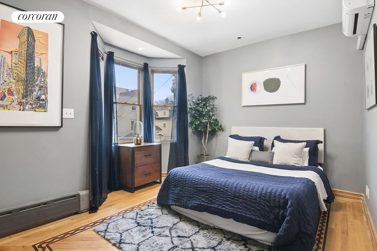 739 Argyle Road Brooklyn, NY 11230 - Photo 15 of 27 a bedroom with a large bed and a window