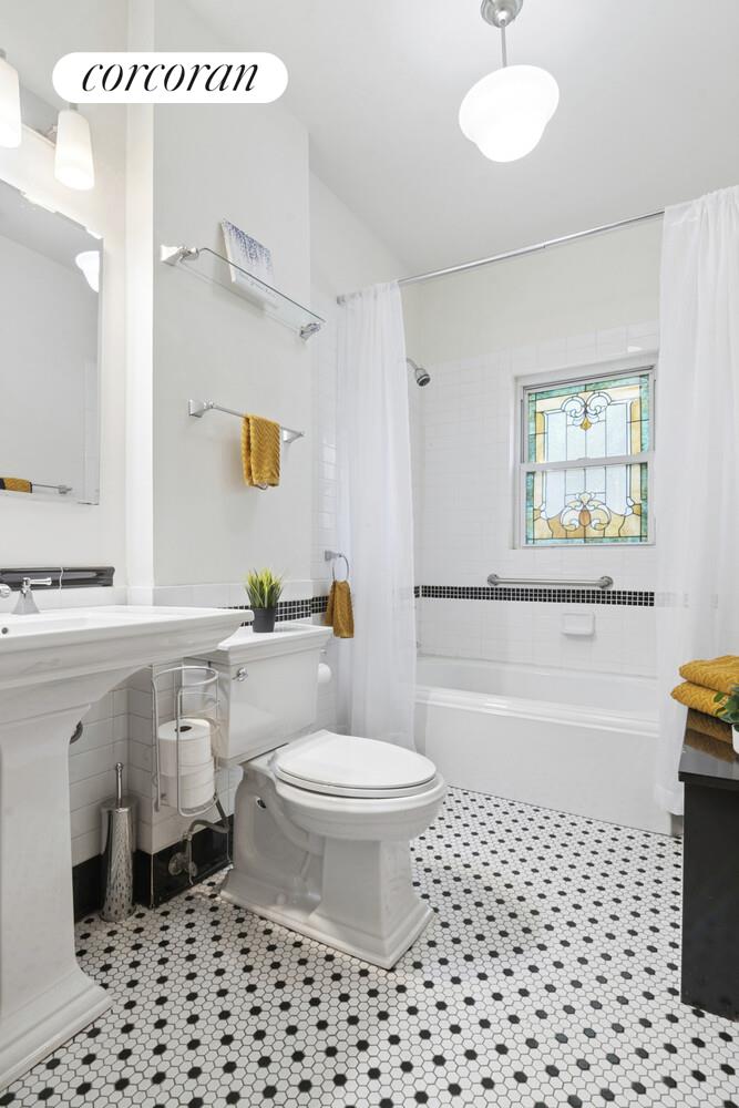 739 Argyle Road Brooklyn, NY 11230 - Photo 16 of 27 a bathroom with a sink a toilet and a bathtub
