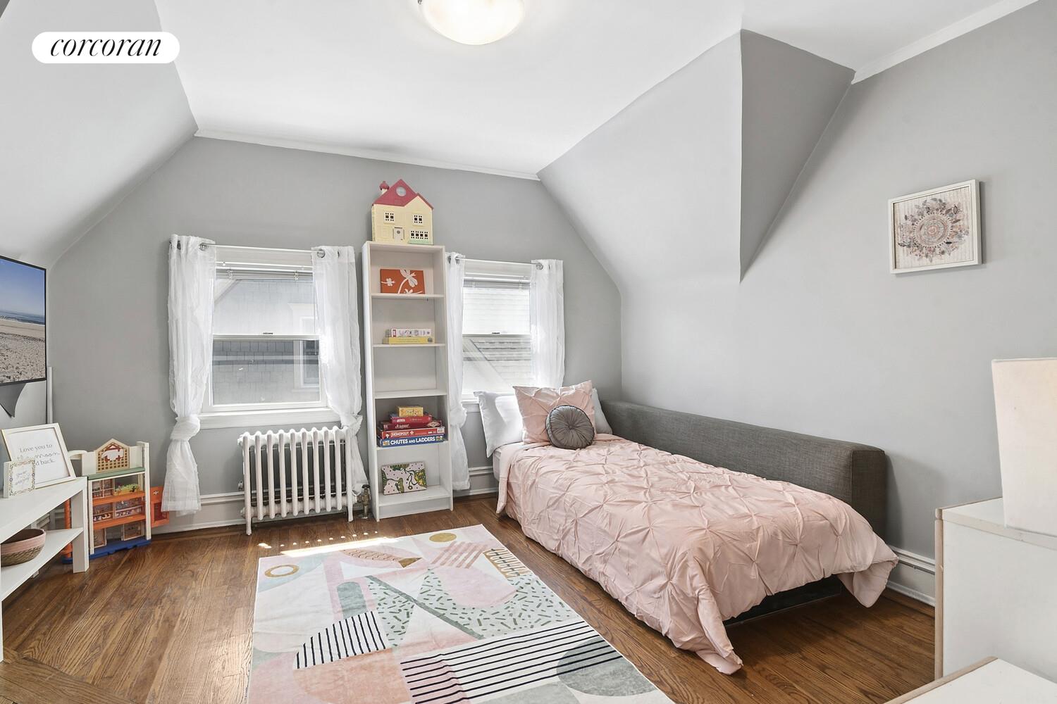 739 Argyle Road Brooklyn, NY 11230 - Photo 17 of 27 a bedroom with a bed and a window