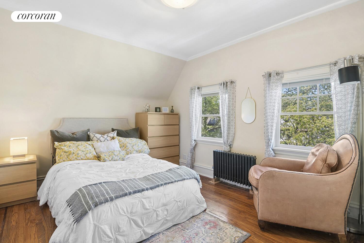 739 Argyle Road Brooklyn, NY 11230 - Photo 18 of 27 a bedroom with bed couch and window