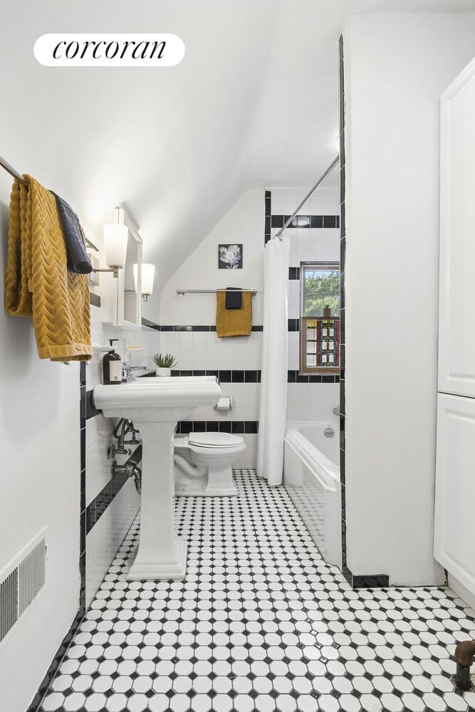 739 Argyle Road Brooklyn, NY 11230 - Photo 19 of 27 a bathroom with a sink a toilet and shower