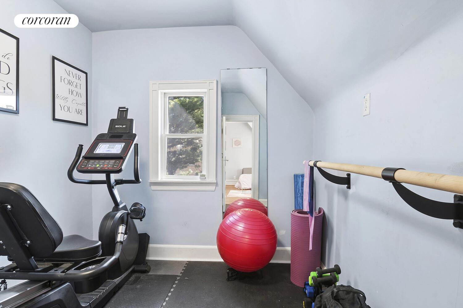 739 Argyle Road Brooklyn, NY 11230 - Photo 23 of 27 a room with wooden floor and gym equipment