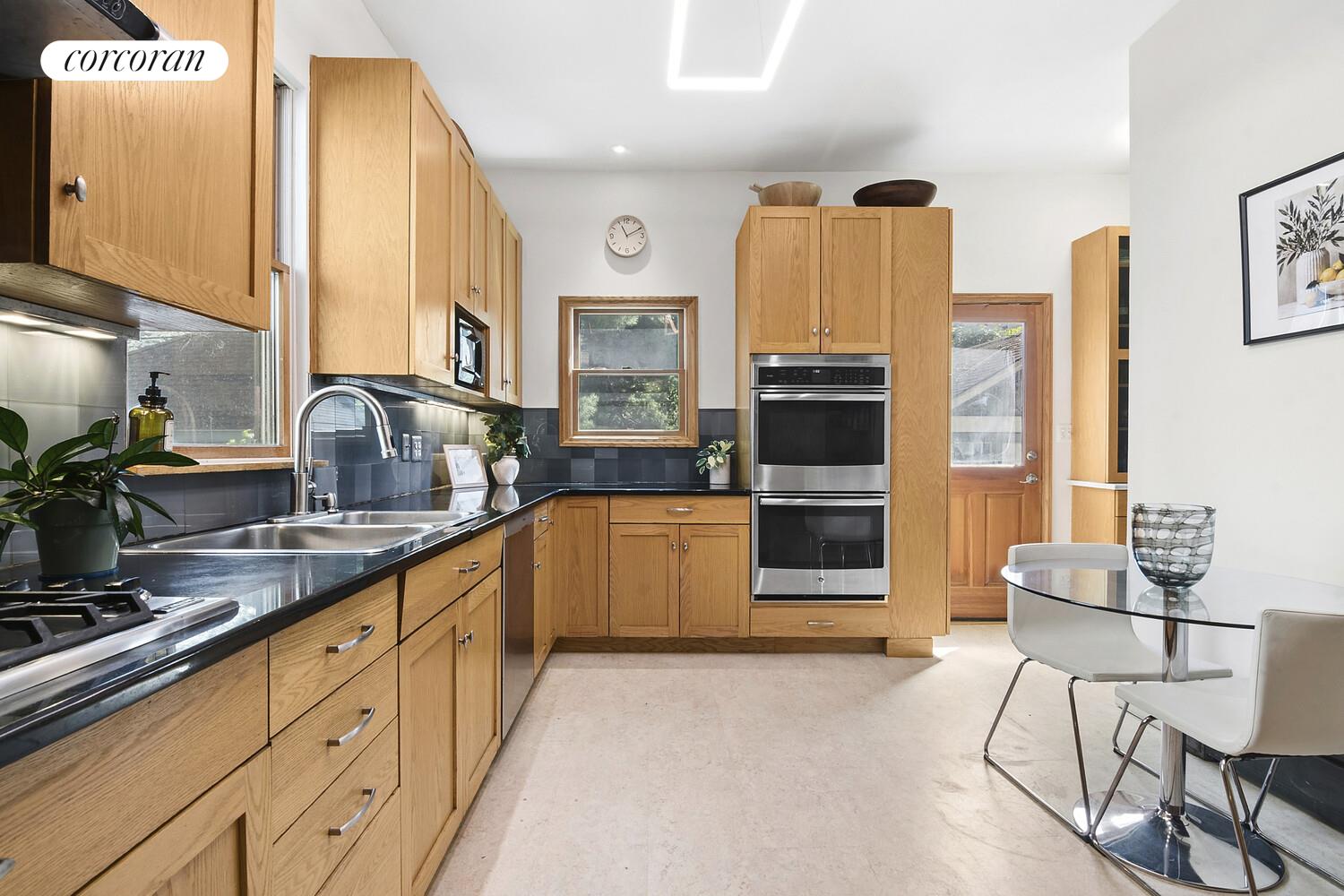 739 Argyle Road Brooklyn, NY 11230 - Photo 8 of 27 a kitchen with stainless steel appliances a stove sink and cabinets