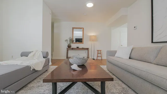 a kitchen with stainless steel appliances a dining table chairs and chandelier