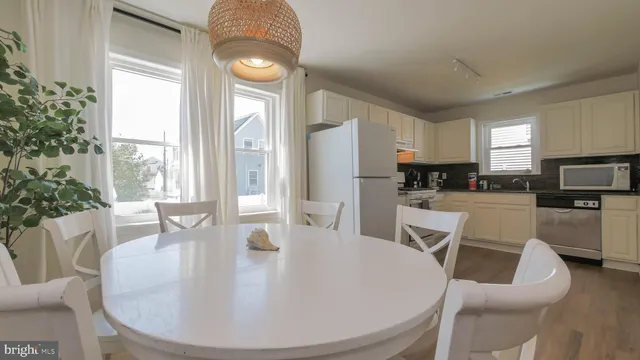 a stove top oven sitting inside of a kitchen