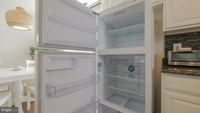 a kitchen with stainless steel appliances granite countertop a stove and a microwave