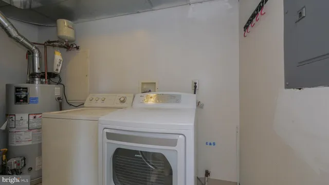a view of a room with a sink and a mirror